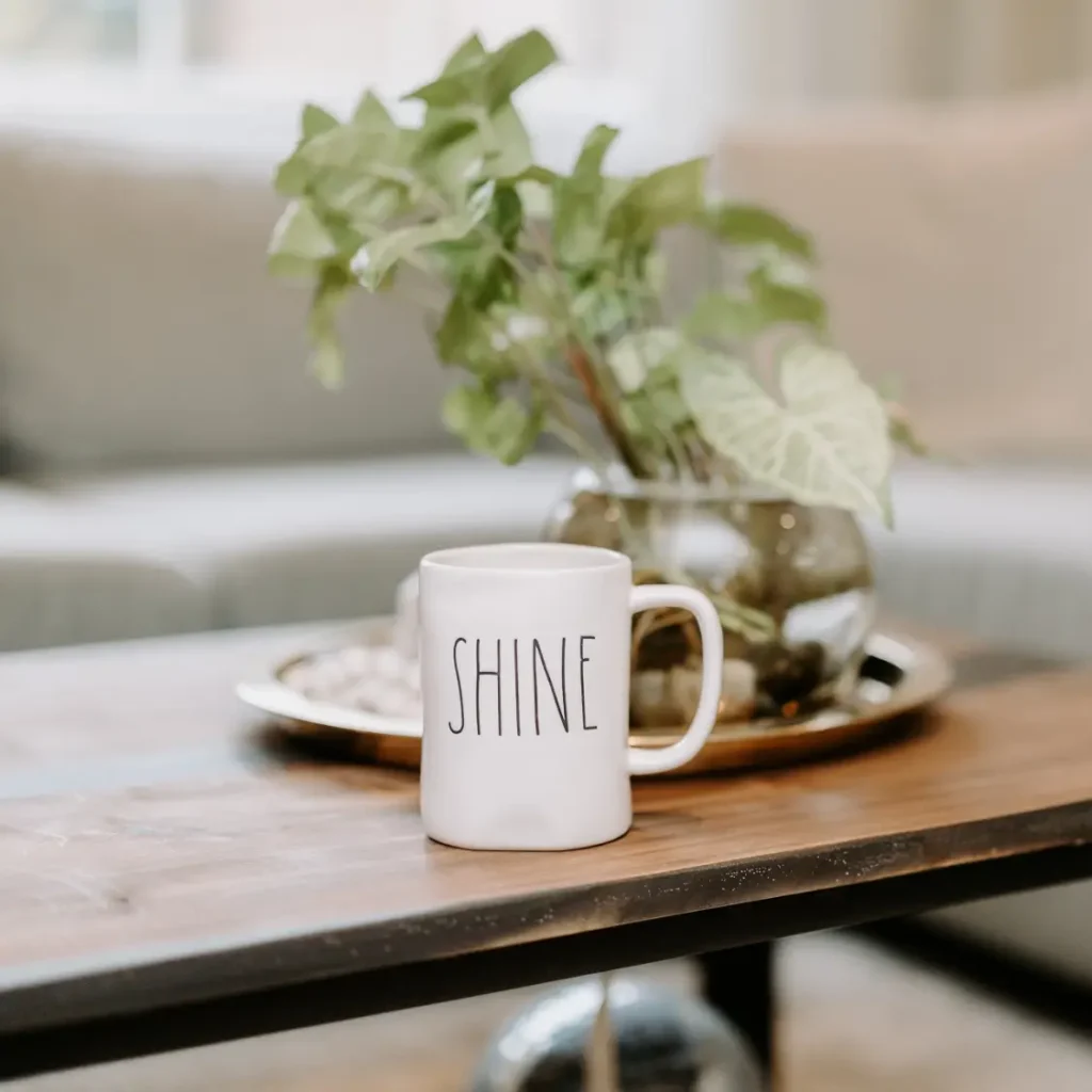 Mug that says shine on coffee table